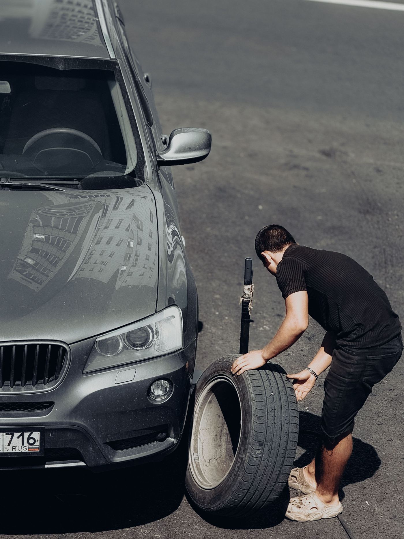 A volunteer changing a flat tire